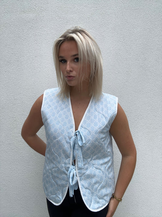 Baby blue bow vest